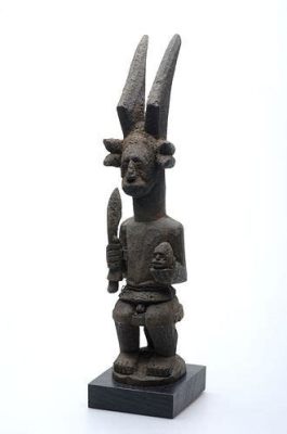 “The Ikenga” Sculpted Deity Embraces Ancient Igbo Symbolism and Spiritual Prowess!